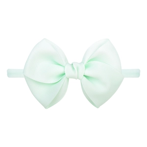 Détail du bandeau bébé vert menthe avec un nœud en ruban gros-grain élastique