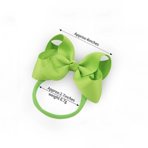 Green ribbon bow nylon headband for baby girls with soft elastic hair tie and size specs