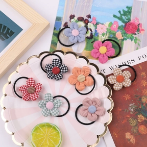 Detailed set of eight colorful floral elastic hair ties for girls in diverse fabric textures