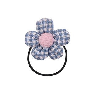 Cute children's flower hair tie with blue checkered petals and pink striped center