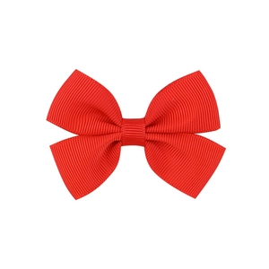 Detailed view of a bright red grosgrain ribbon hair bow clip with fine ribbed texture