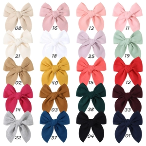Grid view of 20 colors vintage fabric bow hair clips in cotton linen texture