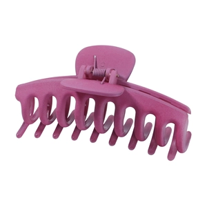 Detail view of large rose pink matte hair claw clip with sturdy metal spring mechanism