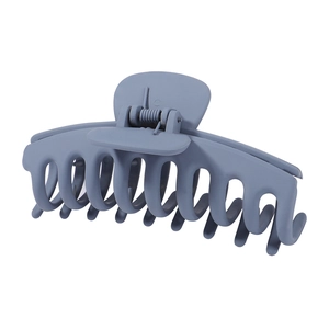 Macro detail of large matte dusty blue hair claw clip with durable metal spring