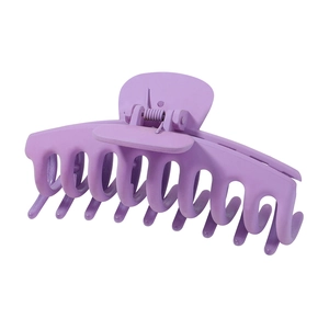 Close-up of matte purple large hair claw clip showing cross-tooth spring grip