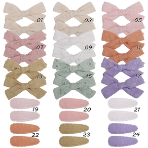 Detailed grid showing cotton floral bow hair clips and matching snap barrettes for girls