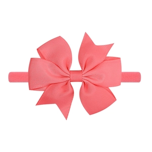 Fascia fiocco rosa corallo in canneté con elastico in nylon per neonati e bambine