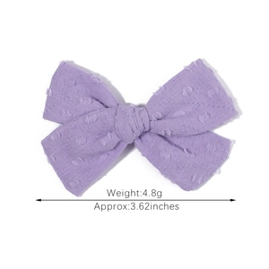 Solid purple cotton hair bow clip with textured 3D dots for girls and kids