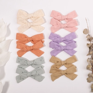 Set of 12 floral embroidered cotton bow hair clips in soft Morandi pastel colors for girls