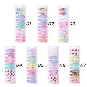 Set of 10 colorful fabric hair clips for girls featuring rainbow and unicorn patterns