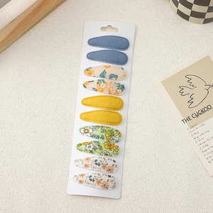 Detail of 10-piece girls' floral embroidery hair clips and fabric snap clips set
