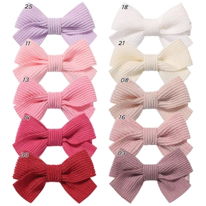 Set of 10 ribbed corduroy bow hair clips for kids in various bright and neutral colors