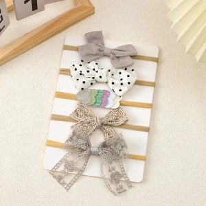 Detailed set of five elastic baby headbands with assorted lace and floral bows