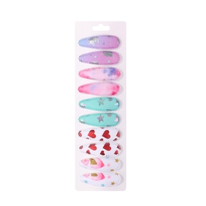 Set of ten colorful kids' BB hair clips with unicorn and heart patterns on paper card