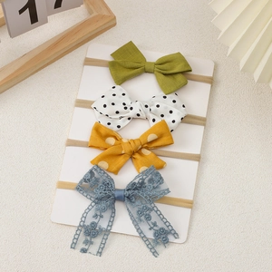 Set of four high-elastic baby bow headbands featuring olive green, polka dots, and blue lace
