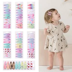 Kids' fabric BB hair clip set featuring heart and rainbow prints on multi-color metal clips
