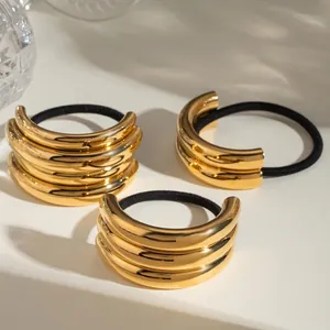 Three-piece set of polished golden metal hair ties with premium elastic bands for women