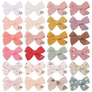 Set of 24 colorful linen bow hair clips for girls with solid colors and floral patterns