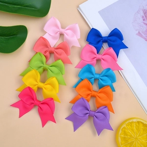 Set of 10 colorful grosgrain ribbon bow hair clips for baby girls in vibrant solid colors