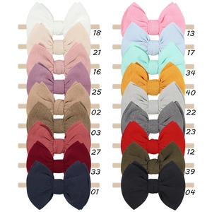 Detailed collection of 18 colorful elastic baby headbands with soft fabric bows
