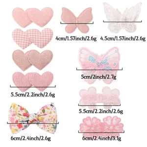 Pink heart and butterfly hair clips for girls with size measurements and floral fabric detail