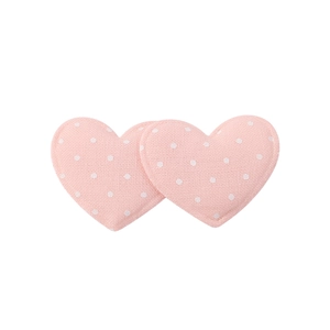 Detail of pink heart-shaped fabric clips with white polka dots and reinforced stitching