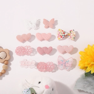 Pink heart and butterfly hair clips set for girls featuring floral lace and sequins