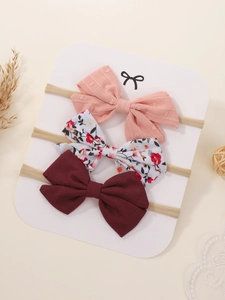 Ensemble de trois bandeaux pour bébé avec nœuds floraux et unis sur ruban en nylon
