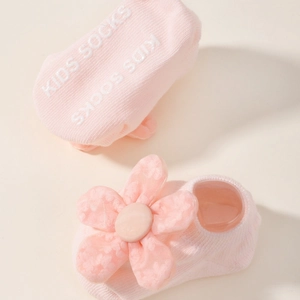 Chaussettes bébé roses en tricot avec fleur en tulle et semelle antidérapante souple