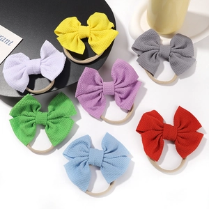 Set of 7 colorful waffle fabric baby bow headbands with elastic seamless bands for girls
