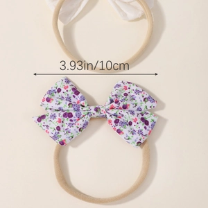 Lot de deux bandeaux pour bébé avec un nœud blanc et un nœud à motif floral violet
