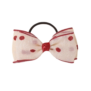 Child hair tie with cream mesh bow featuring red polka dots and matching red border