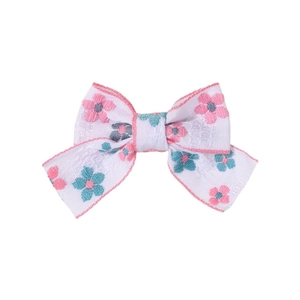 Bow hair clip with floral embroidery on white textured fabric for girls and teens