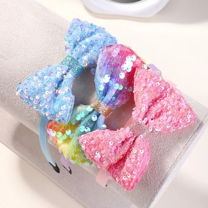 Sparkly sequin bow headbands for girls in gradient rainbow and pastel glitter colors