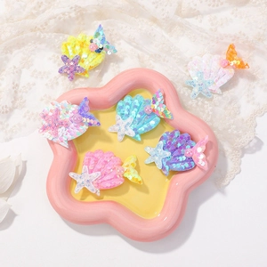 Barrettes sirène à paillettes avec coquillages, étoiles de mer et perles en tons pastel