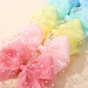 Pastel mesh bow hair clips for girls in pink yellow green and blue color variety