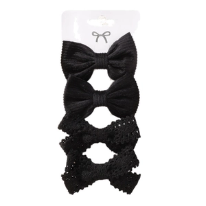 Set of 4 black bow hair clips for kids featuring ribbed fabric and crochet lace patterns