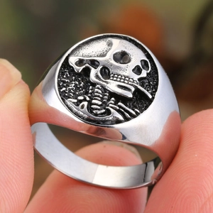 Punk style skull signet ring in vintage silver titanium steel for men with embossed detail