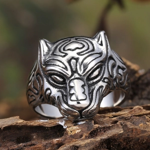 Vintage stainless steel leopard head ring for men with tribal carvings on rustic wood