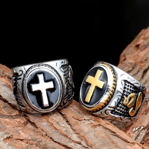 Men's vintage cross rings in steel and gold finish with detailed totem engravings
