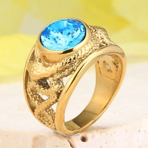Vintage gold-plated titanium ring featuring a faceted blue gemstone with woven texture