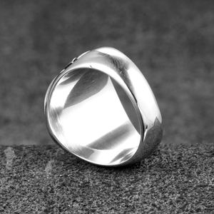 Polished stainless steel signet ring for men in a minimalist cross-style fashion