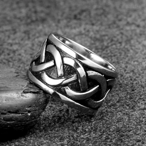 Macro view of Celtic knot relief on punk style vintage stainless steel ring band