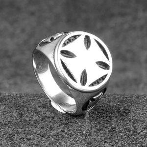 Macro shot of vintage silver stainless steel ring with hollow cross geometric pattern