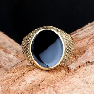 Vintage gold-plated signet ring for men featuring an oval black stone and scale texture