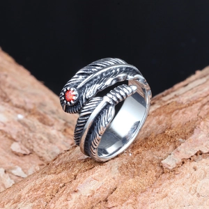 Retro titanium steel feather ring with red gemstone in a vintage oxidized finish