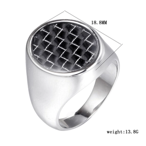 Detail of gold titanium steel signet ring with black carbon fiber inlay and 18.8mm diameter