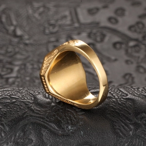 Macro shot of gold Taoist Bagua ring showing textured side details and polished inner band