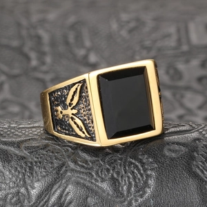 Vintage men's gold stainless steel signet ring with black onyx and eagle side carving