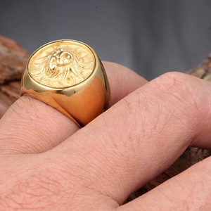 Bold vintage gold lion head signet ring for men in stainless steel on hand model